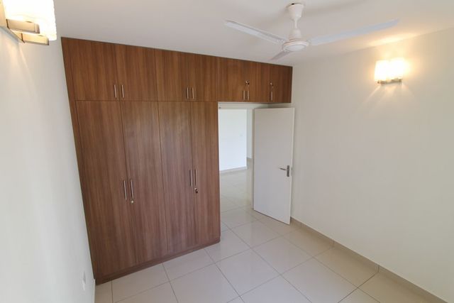 Bedroom with wood finish wardrobes