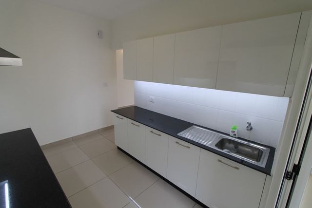 Fitted kitchen with concealed counter lighting